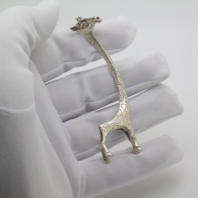 A vintage object depicting a stylized giraffe, handcrafted in Italy between the 1980s and 1990s in authentic continental...