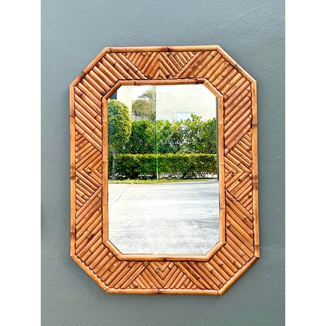 Bring a touch of coastal sophistication to your home with this striking vintage octagonal wall mirror. Expertly hand-...