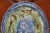 Decorate a wall or display shelf with this colorful 19th-century glazed terracotta plate. Sculpted in Beaune, France circa...