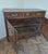 This elegant French carved oak buffet is a charming example of provincial craftsmanship. It features a beautifully aged...