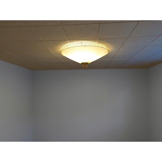 The ceiling lamp was manufactured by Oy Valinte in Finland in the 1950s. Model number 1241. The lamp has a beautiful...