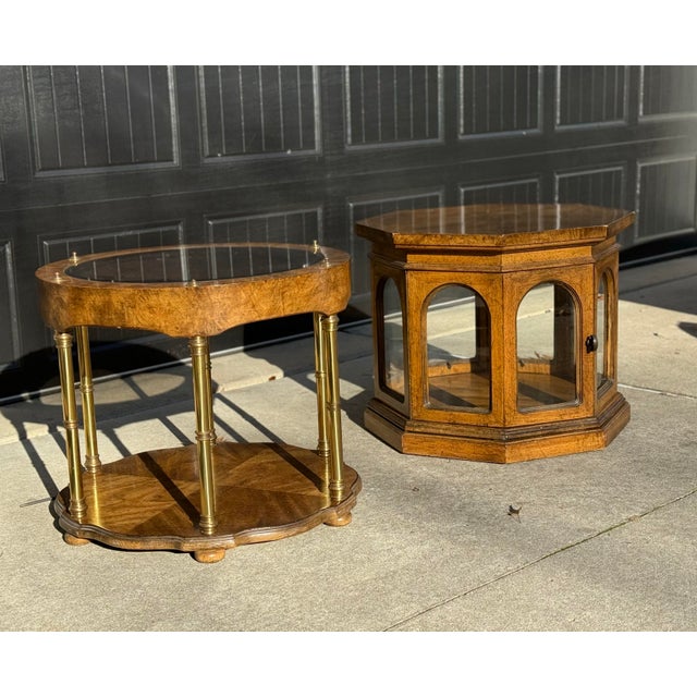 A striking pair of vintage burl wood accent tables blending mid-century modern and Hollywood Regency design. This set...