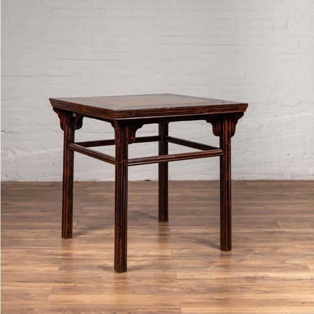 A Chinese 19th century elmwood center hall table with Ming dynasty 15th or 16th century courtyard stone inset. Born in...