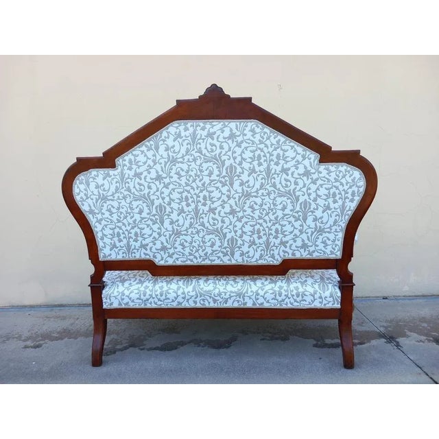 Strange open sofa. Curve lines and faceted foot. Shield backrest. Very comfortable. Sofa in solid cherry with rosewood...