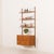 This teak wall unit designed by hansen and guldborg comes from the 1960s and embodies the essence of danish mid-century...