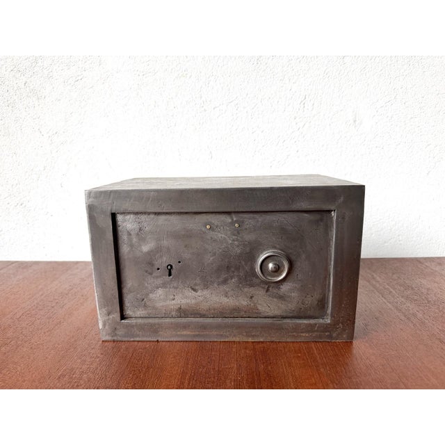 Small French safe made of sheet steel, manufactured around 1900-1920. It's a safe designed for private use, compact enough...