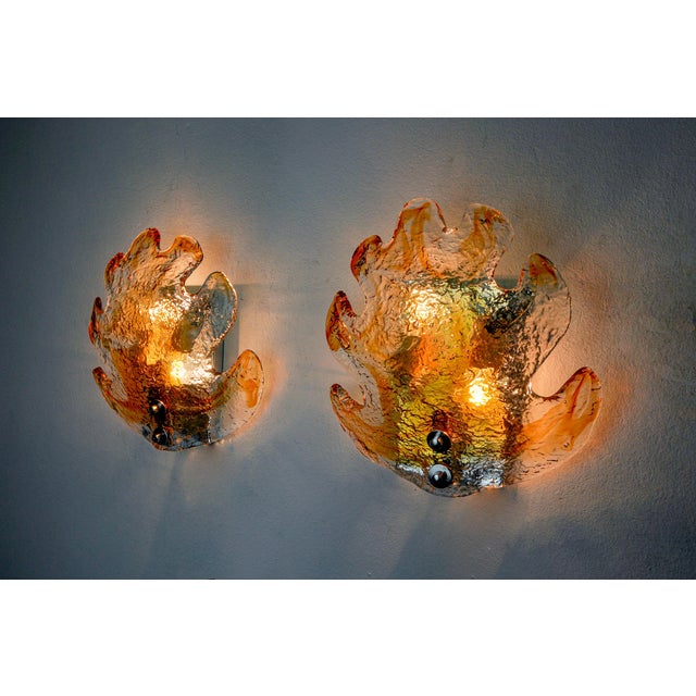 Very beautiful and large pair of mazzega floral wall lights designed and produced in Italy in the 70s. This pair of wall...
