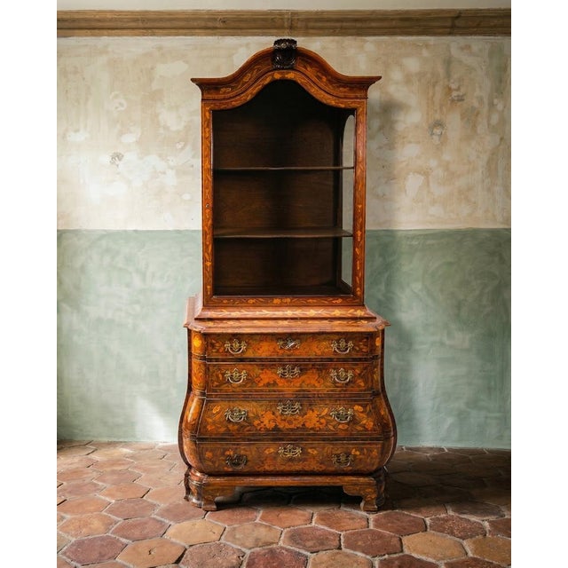 Meet floral fantasies in cabinet form. Small in stature but big on charm, this dutch marquetry vitrine is proof that great...