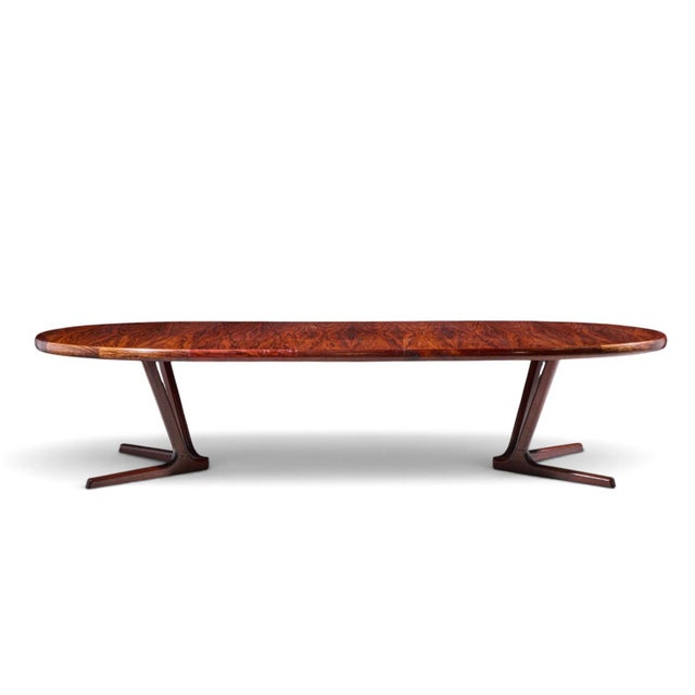Interform Mid Century Rosewood Expanding Dining Table with 3 Leaves This table measures: 68.75 wide x 47.25 deep x 28.25...