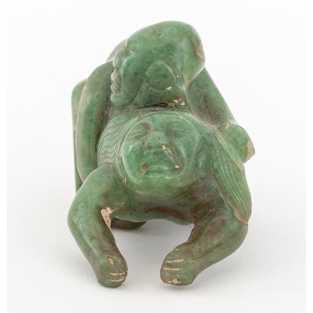 Olmec Pre-Columbian Carved Jade Erotic Sculpture, depicting a male figure embracing a female figure. 1.75" H x 3.25" W x...