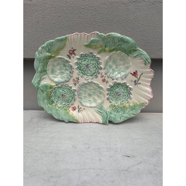 Very rare 19th Century large Majolica artichoke platter signed Longchamp. The platter is decorated with large artichoke...