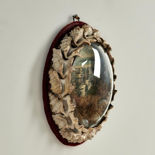 Rare and unusual English 19th century sailors valentine handcrafted with exotic seashells. Around an image of figures and...