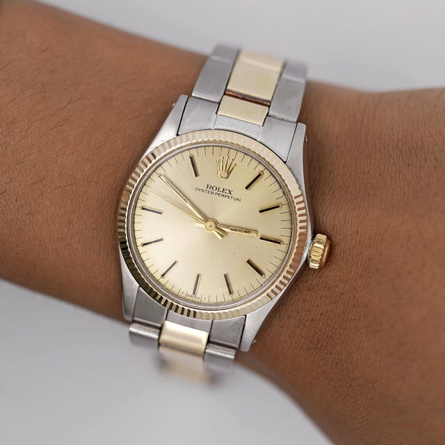 A 1972 vintage Rolex Oyster Perpetual ref. 6551 in two-tone stainless steel and 18K yellow gold, featuring a champagne...