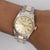 A 1972 vintage Rolex Oyster Perpetual ref. 6551 in two-tone stainless steel and 18K yellow gold, featuring a champagne...