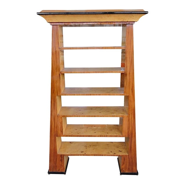 Trapezoid bookcase in mahogany and birch root. Black lacquered finishes. Six shelves. Dimensions (wxdxh) 114 x 41 x 204 cm