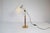 This lamp was made in Sweden at Falkenbergs Belysning. It has an adjustable height and angle arm, and is made in brass,...