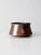 Antique hammered copper cauldron with a rounded bottom, tapered sides, and a rolled rimmed top lip. Hand-formed from heavy...