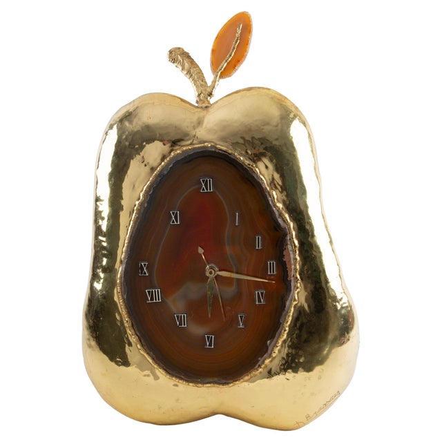 This whimsical yet refined mid-20th-century clock-lamp takes the form of a stylized apple, executed in gilt metal and...