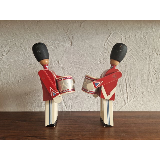 A set consisting of two Danish Army Guard soldiers by Kay Bojesen. Early versions, both figures are marked. Some with age-...