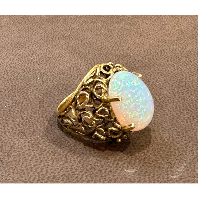 Vintage 11 Carat Oval Shape Ethiopian Opal Cocktail Ring 14kt Yellow Gold Ring For Sale In New York - Image 6 of 18