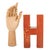 A wooden letter "H" that served as a tool for children at school. The letter is painted yellow on one side and red on the...