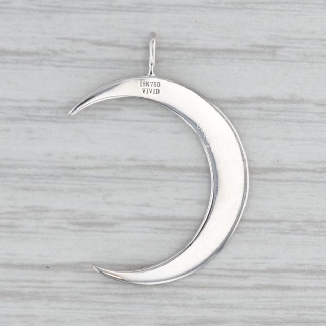 This lovely Vivid pendant features diamond dots across a crescent moon done in white gold with a bright polished finish....