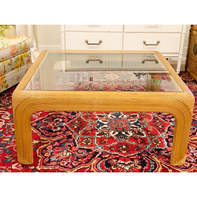 A true vintage standout—this 1970s pencil reed or split reed coffee table brings effortless Palm Beach charm to any space....