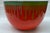 Here we have a super enameled bowl with dropdown lines of different colors around the perimeter , Displayed at the...