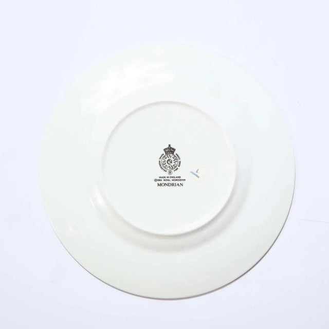 This stunning service for fourteen "Mondrian" fine china plates were realized by Royal Worcester in 1984 in the United...