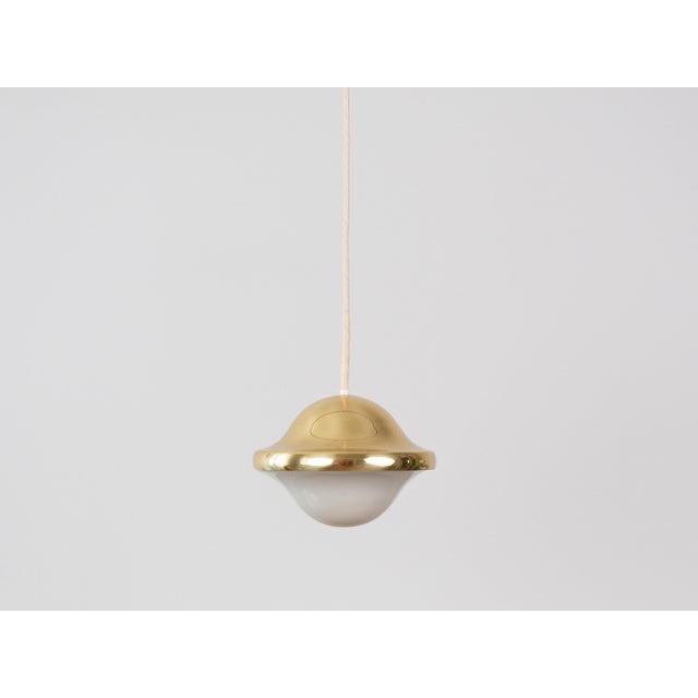 The original Bubi lamp, designed by Henning Koppel for Louis Poulsen, is an icon of Danish design from the 1970s, with a...