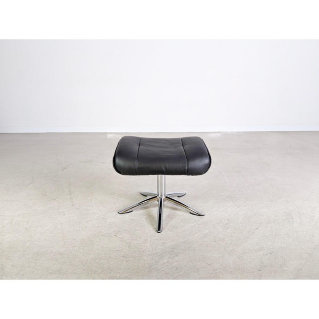 We are offering a beautiful, swiveling footstool in black leather for sale. This ottoman is ideal for complementing an...