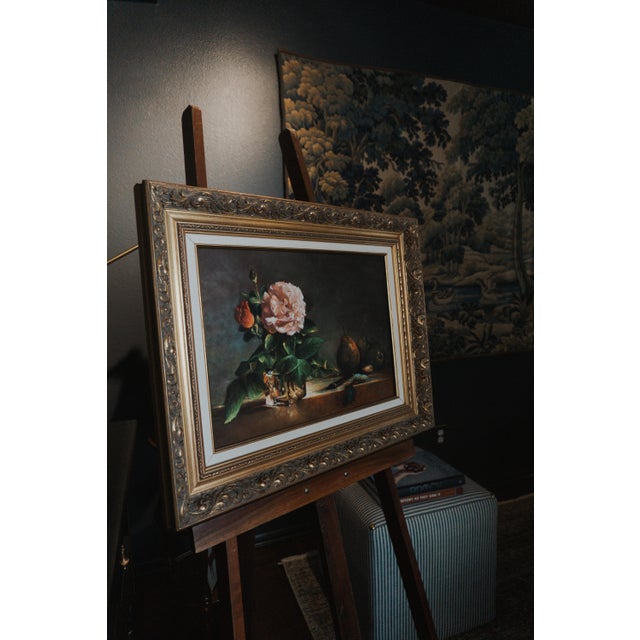 Mid-century French still life oil painting featuring a delicate pink rose, ripe pears, and rich, earthy tones. Set in an...