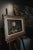 Mid-century French still life oil painting featuring a delicate pink rose, ripe pears, and rich, earthy tones. Set in an...