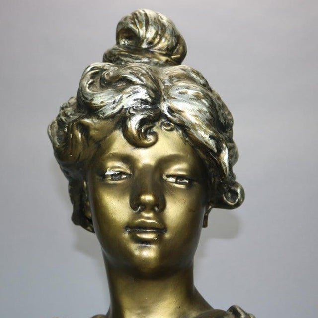 An antique Art Nouveau sculpture offers plaster construction depicting portrait bust of a woman on plinth, c1910 Measures:...