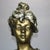 An antique Art Nouveau sculpture offers plaster construction depicting portrait bust of a woman on plinth, c1910 Measures:...