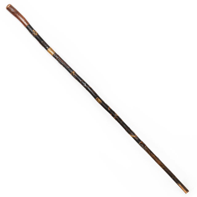 CARVED FOLK ART MASONIC WALKING STICK Stained, ebonized and polychromed hardwood With bas-relief symbolism along the...
