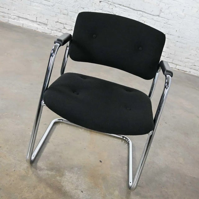 Handsome vintage modern black & chrome cantilever chair by United Chair Company in the style of Steelcase. Comprised of a...