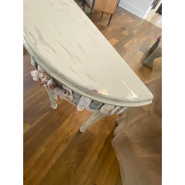 Demi lune shell encrusted console table by Bluffton, SC Artist, May River Neptune. Table is from Ballard Designs. The...