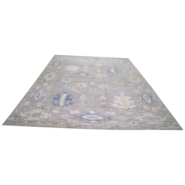 Hand-knotted with care using traditional rug making techniques, this wool rug blends timeless craftsmanship with a modern...