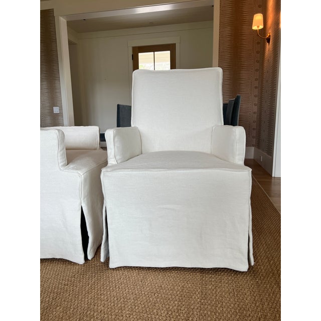 Pair of Slipcovered dining chairs. Linen is "Sanders Oyster Grade: LX" on the Lee fabric line. Belgian linen. Frame is...