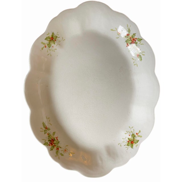 Vintage ironstone Christmas platter with scalloped edge and holly decoration. Produced in the early 1900s by The Colonial...