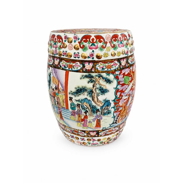 A vibrant Chinese porcelain drum table or garden stool with richly detailed hand-painted decoration throughout. The piece...