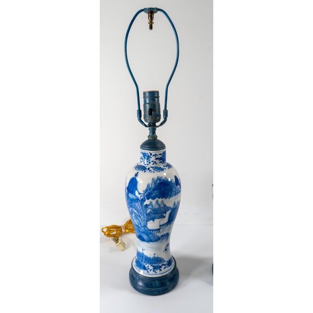 We are selling this very decorative pair of Chinese blue and white lamps. These Vases are 19th century with landscape...