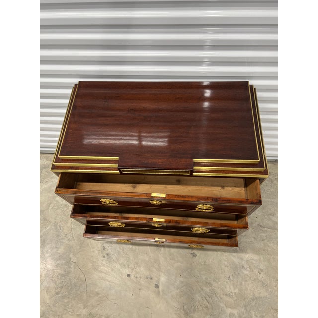 A very fine early 19 Century Neo-Classical Russian Commode of tree drawers in mahogany veneer with brass detailing...
