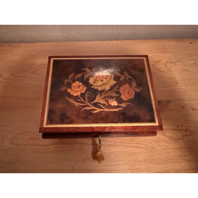1970's Vintage wood jewelry music box plays the theme from "Love Story". Floral inlay design in shades of umbers. Glossy...