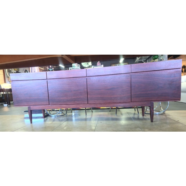 Credenza/Sideboard designed by Ib Kofod-Larsen, model FA66, produced by Faarup Møbelfabrik in the 1960s. The sideboard is...
