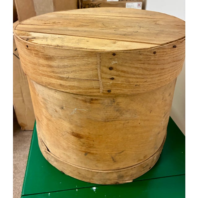 Vintage wood hatbox, 16.5" diameter, 14 " high. Pencil writing on top of box probably describing the hats that were stored...