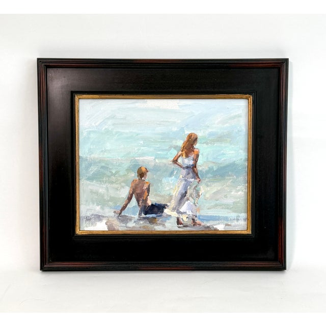 This original oil on board features an impressionist painting of a couple at the beach in a new black and gold plein air...