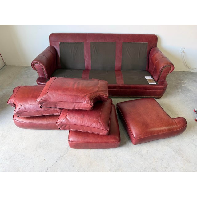 Timeless and richly patinated, this vintage Hancock & Moore 3-seater sofa embodies classic English style with its deep red...
