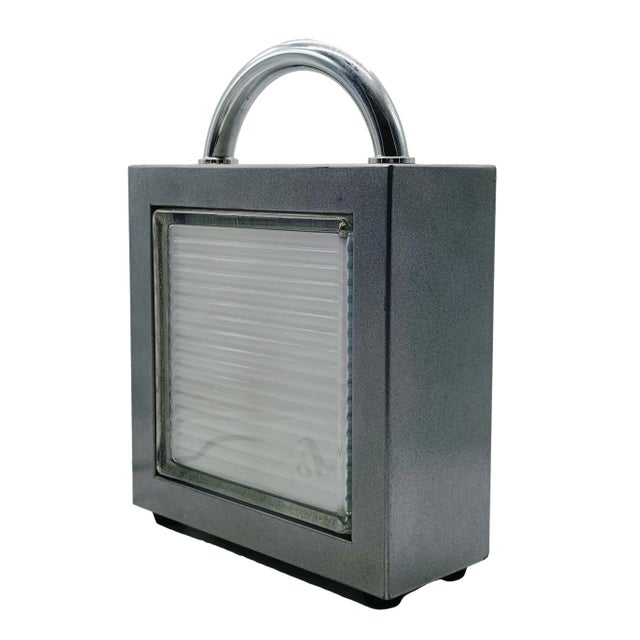 Beautiful Valigetta table lamp, designed by Matteo Thun for Bieffeplast in 1985. Made in Padua, Italy, in the late 1980s....